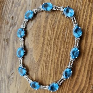 10k blue topaz & diamond bracelet. Stamped 10k. White gold. Please note: one tin